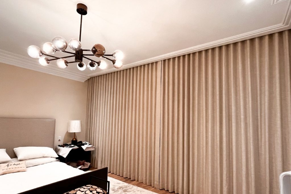 Custom ripplefold blackout drapes in master bedroom in Hoboken, NJ