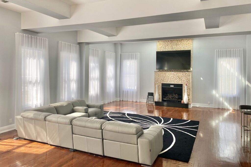 Custom Sheer Drapes Kinnelon NJ 1 in living room with sofa and fireplace