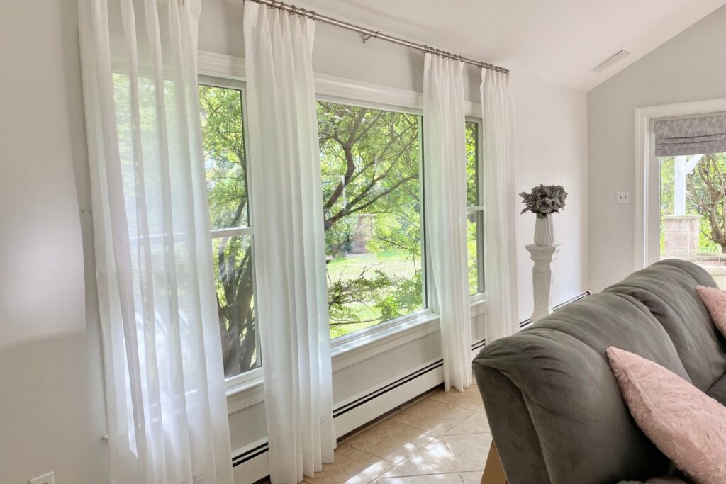 Custom sheer drapes and roman shades in sun room in Allendale NJ 1